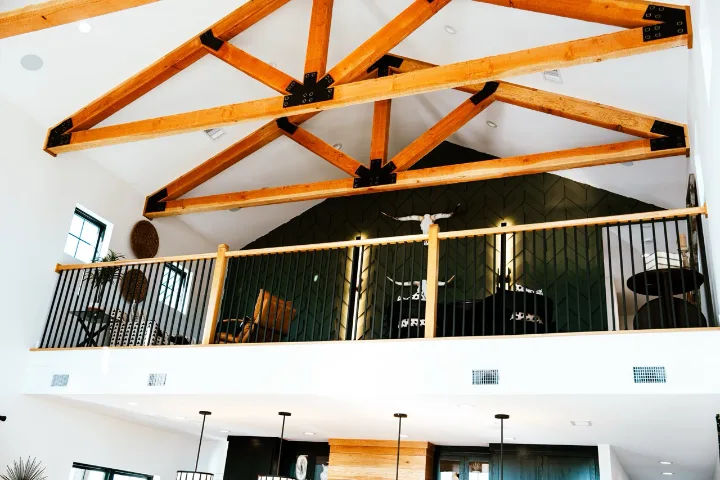 Exposed timber trusses in a finished great room
