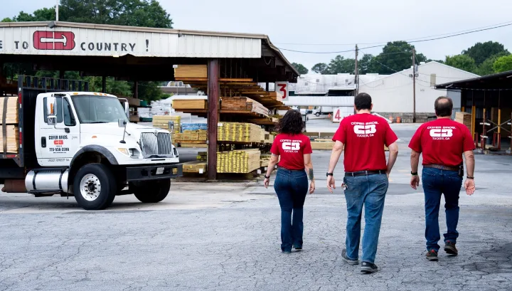 Cofer Brothers team walking the lumberyard