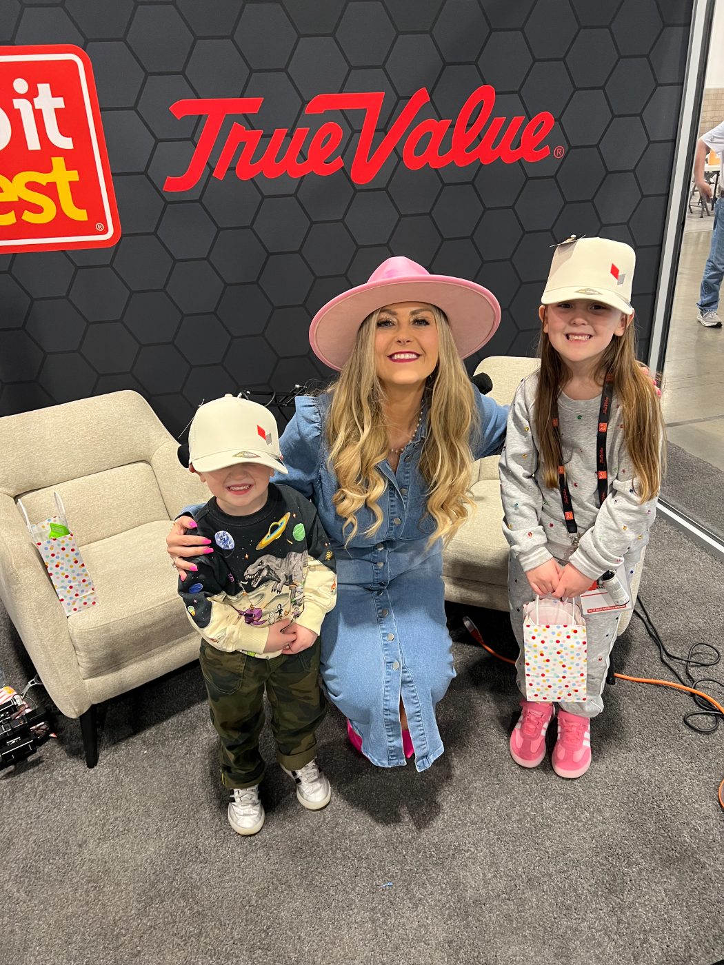 Stefanie Couch with kids at the Do it Best and True Value market