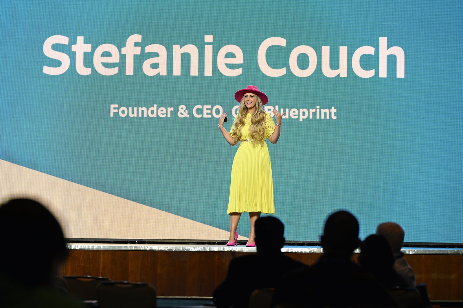 Stefanie Couch, founder and CEO of Grit Blueprint, speaking on stage