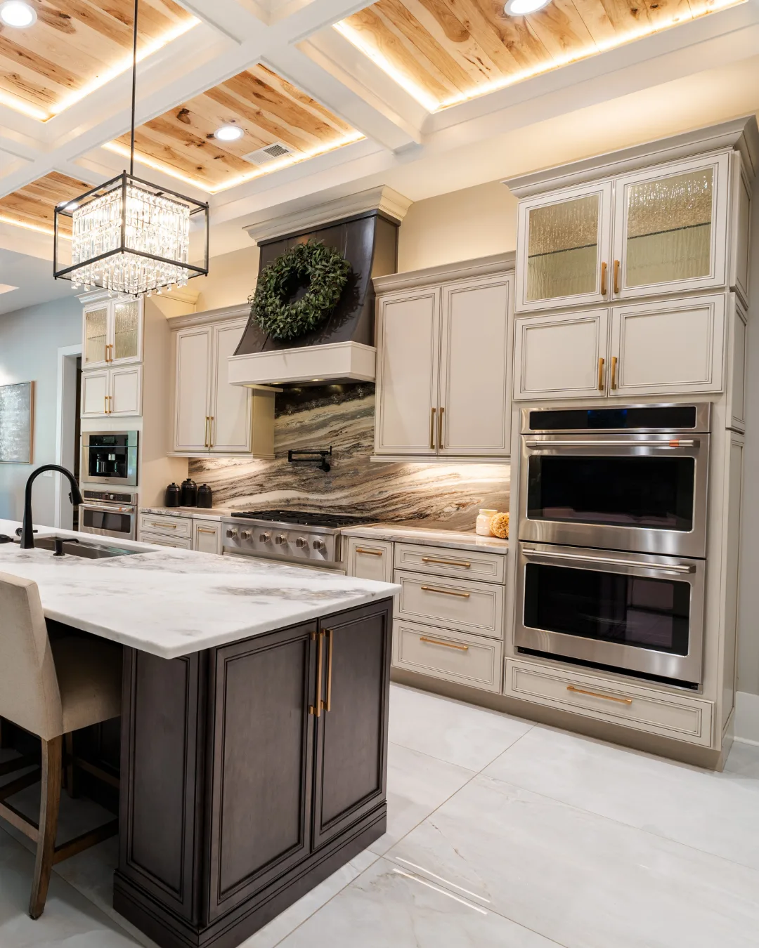 TLC Elite luxury kitchen with crystal chandeliers and marble island, photographed by Grit Blueprint