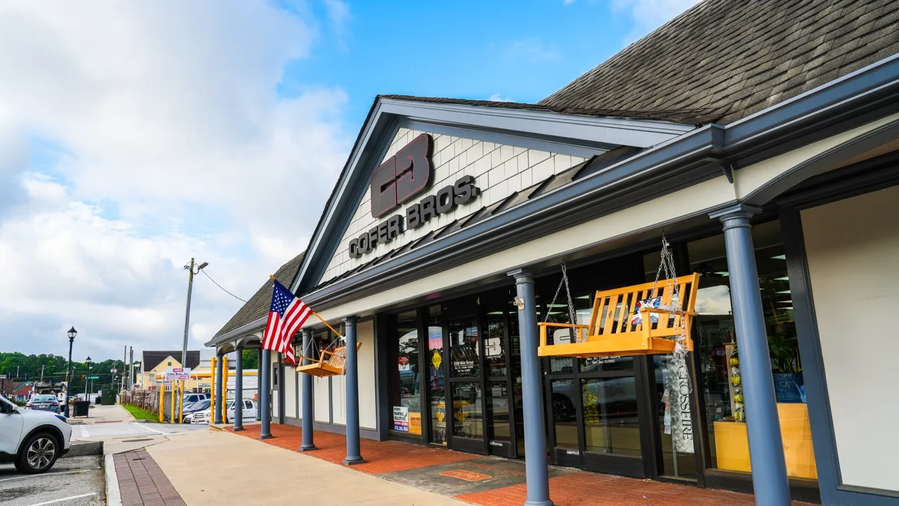 Cofer Bros. storefront with the CB monogram, columns, and porch swings on display, photographed by Grit Blueprint