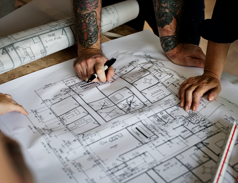 Image - Architect working on a blueprint for a new project