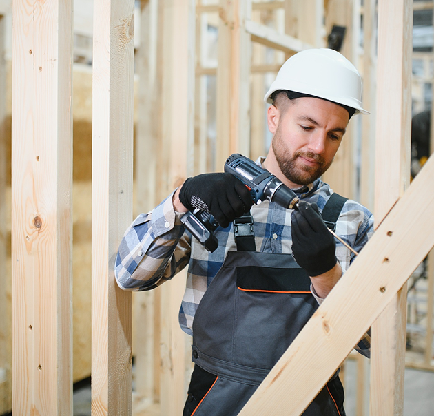 Image - Portrait of a carpenter in a lumber warehouse, showcasing expertise in the modular building industry