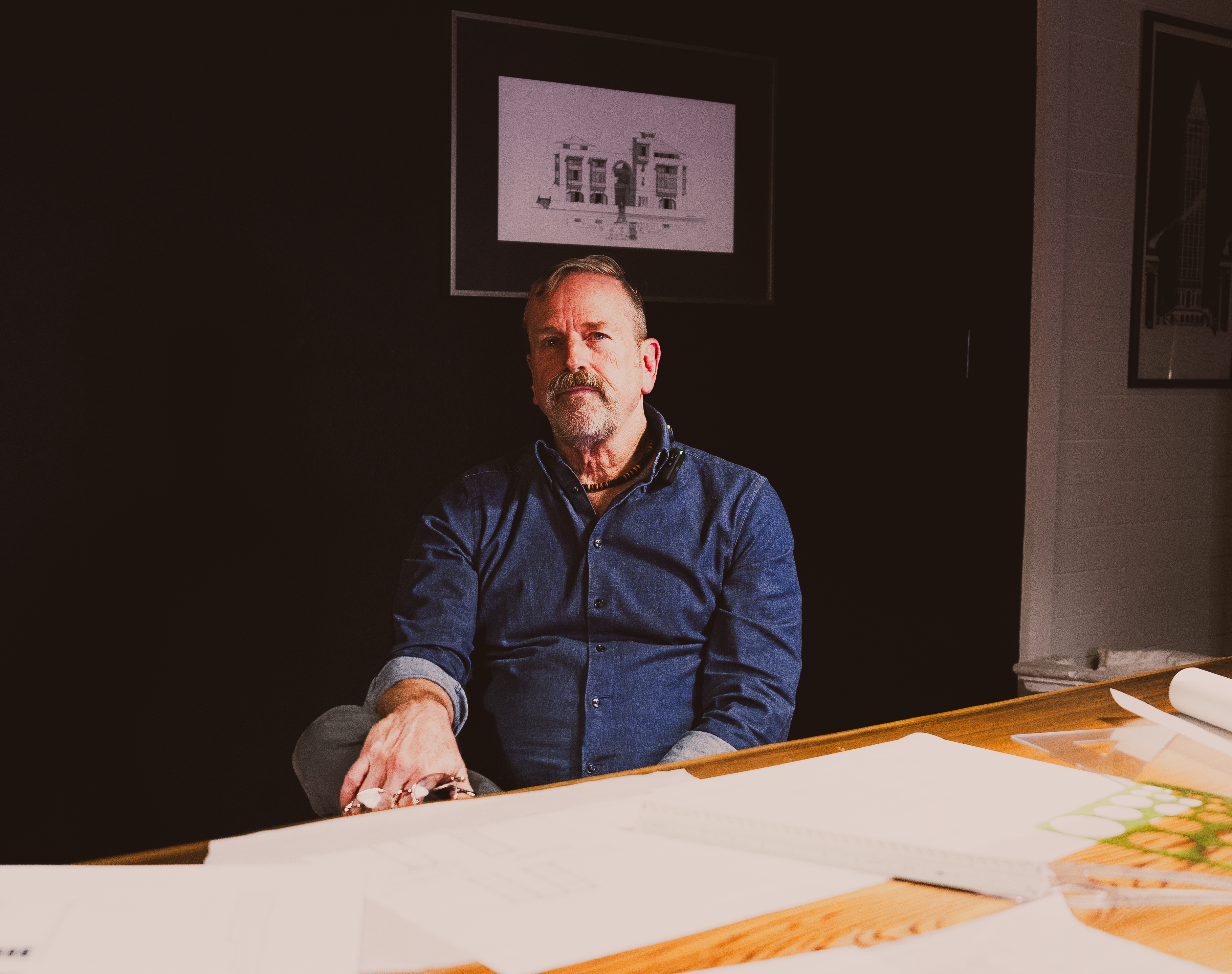 Architect and town planner Lew Oliver at his drafting table