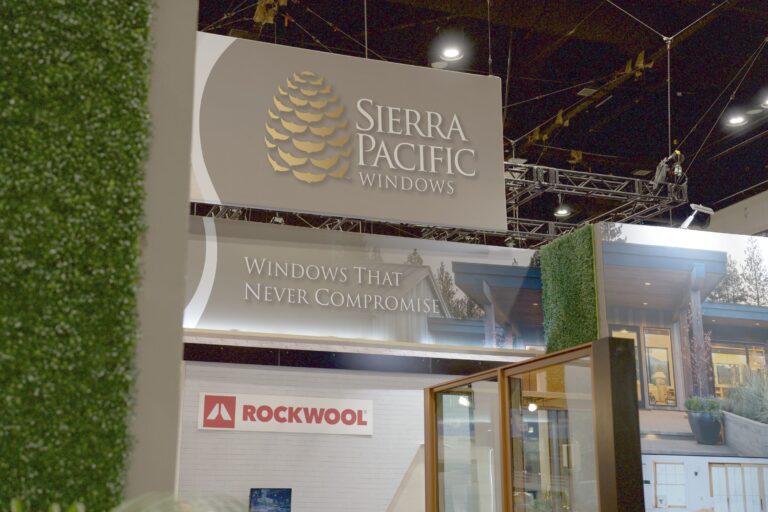Sierra Pacific Windows sign reading Windows That Never Compromise above a window display