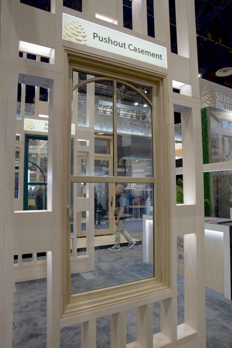 A wood casement window display labeled Pushout Casement