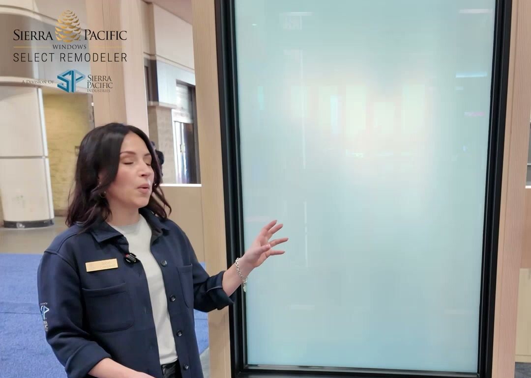 Sarah Campbell of Sierra Pacific Windows beside a frosted glass panel