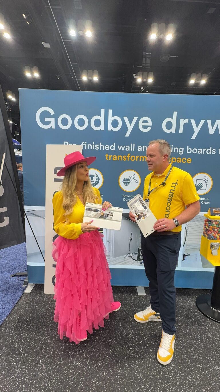 Stefanie Couch and Joel Koops of Trusscore talking at the Trusscore booth at IBS 2026